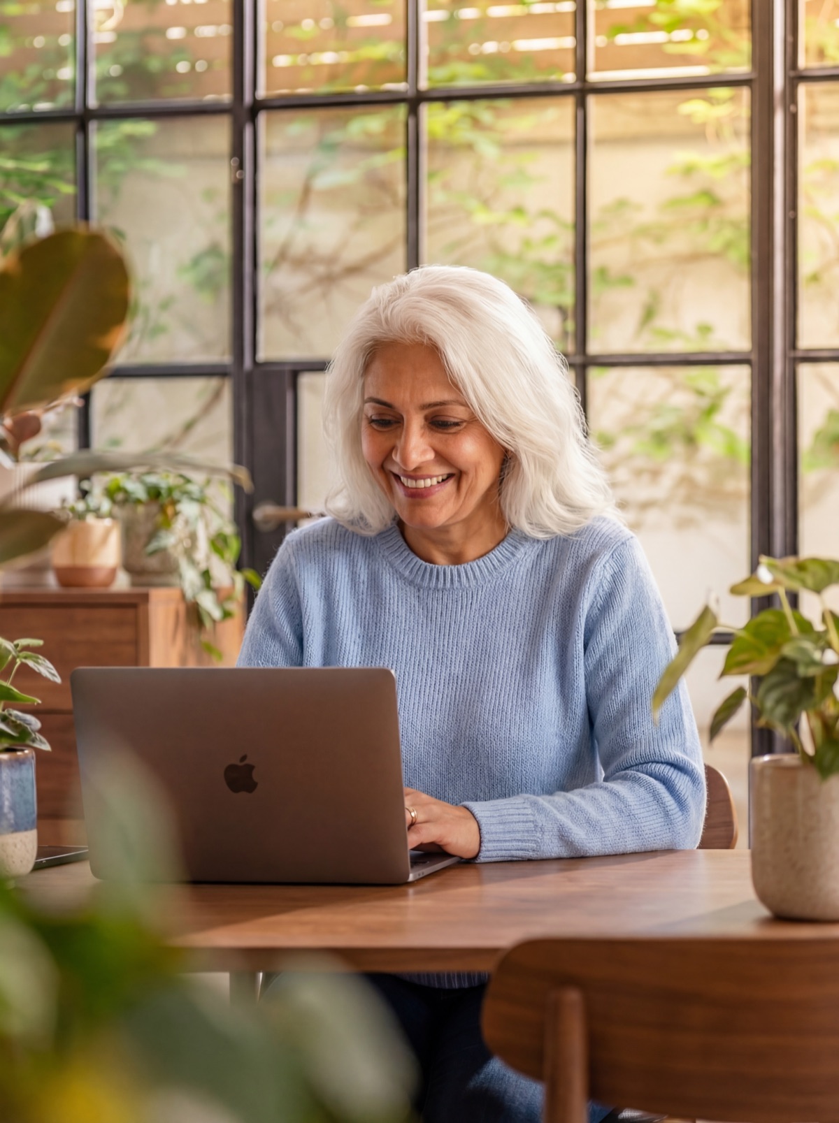 Happy homeowners reviewing remortgage paperwork together at home